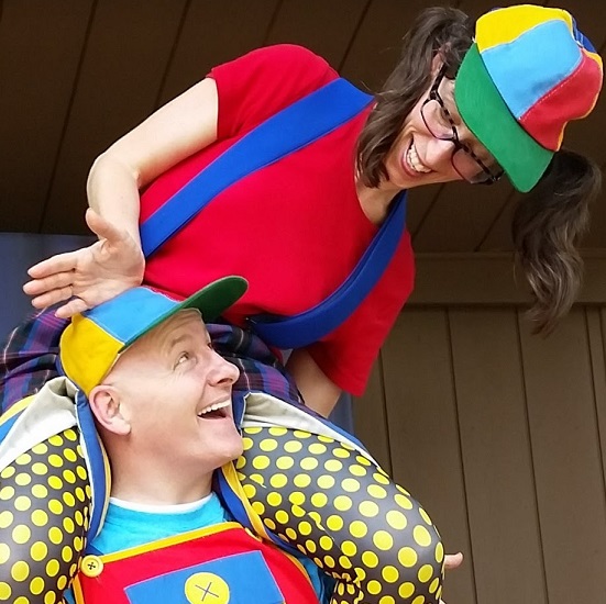Mark and Lori Hurley wearing bright and colorful clothing